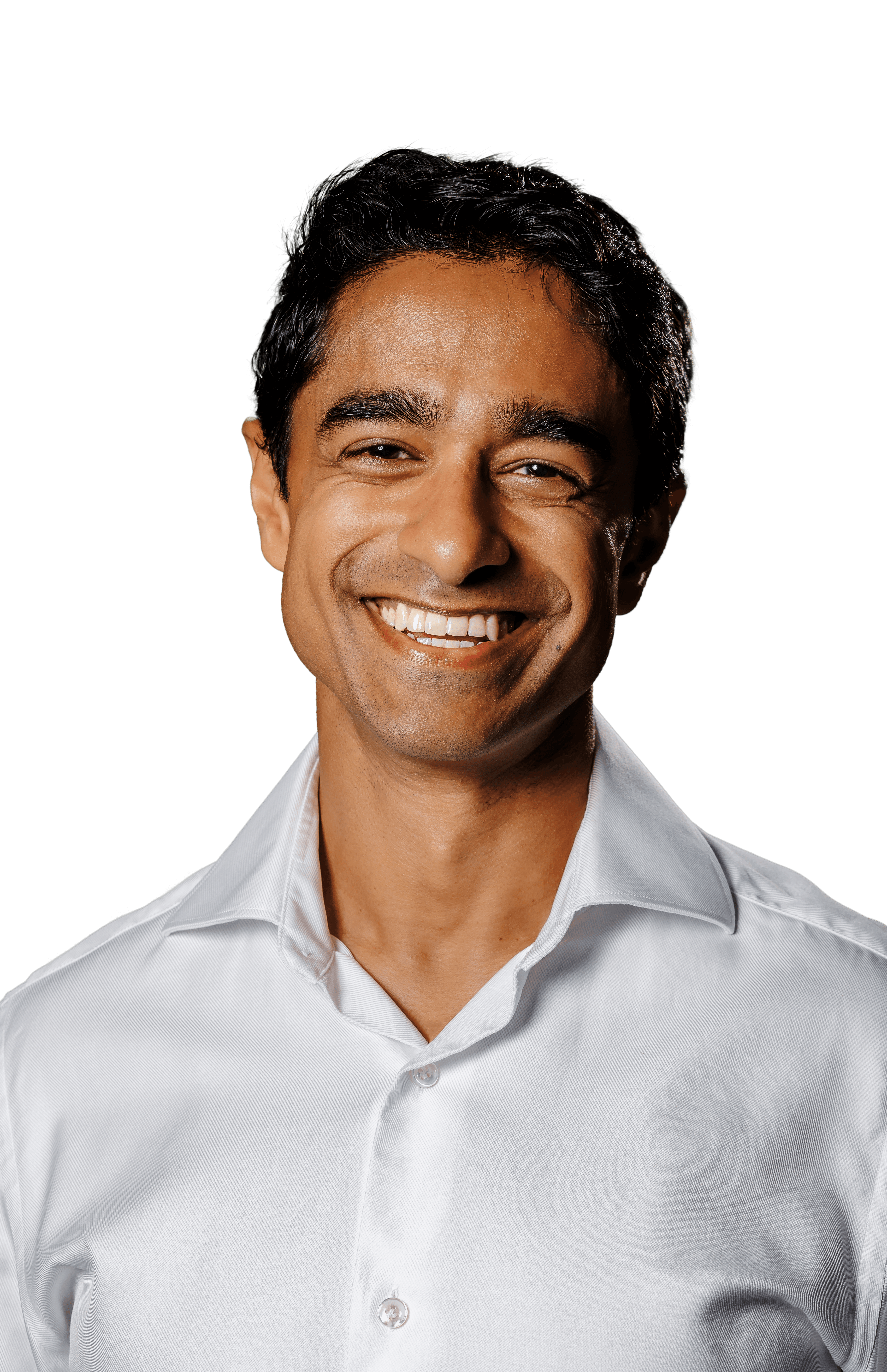 Saikat Chakrabarti smiling in a white button-up shirt