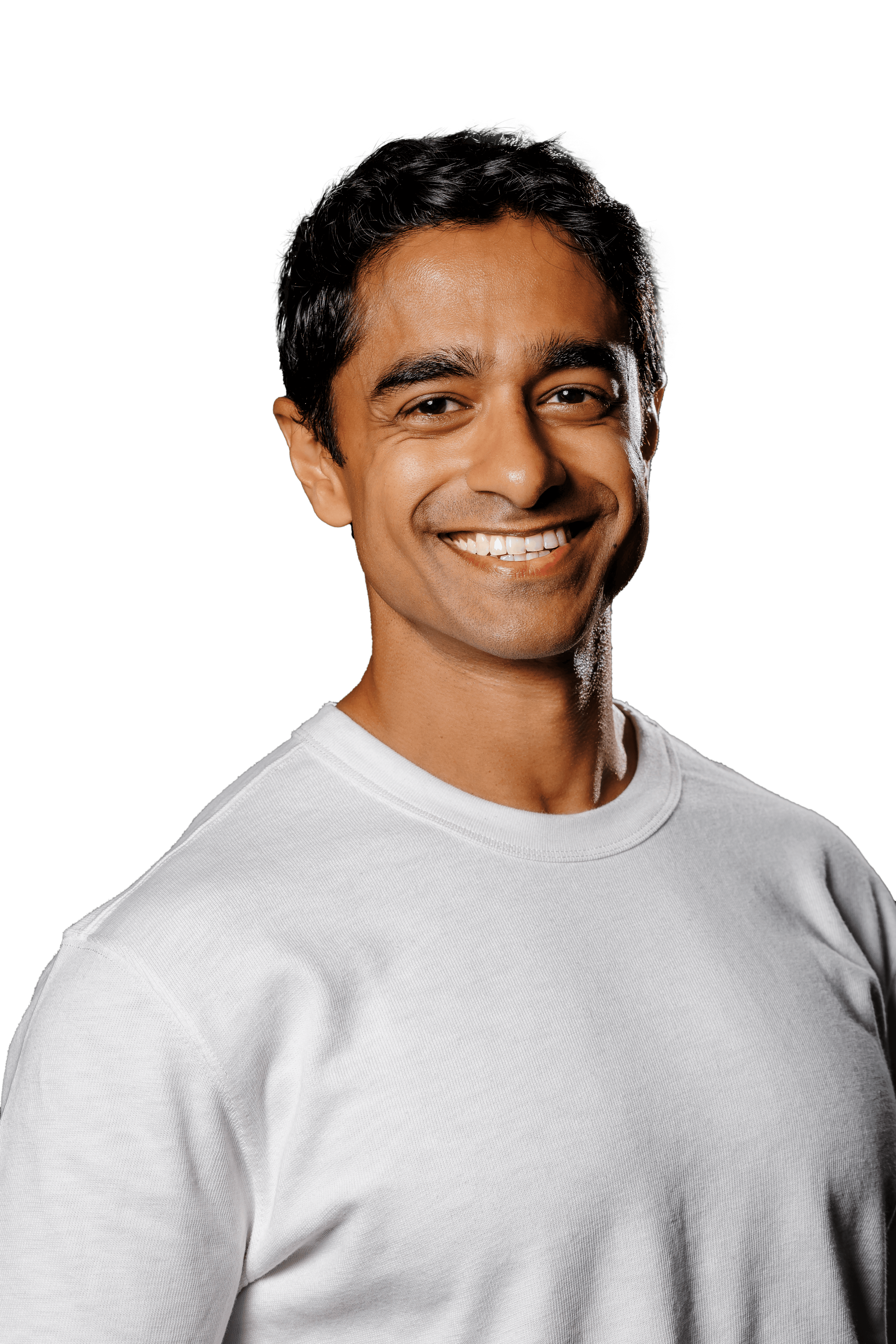 Saikat Chakrabarti smiling in a gray sweater